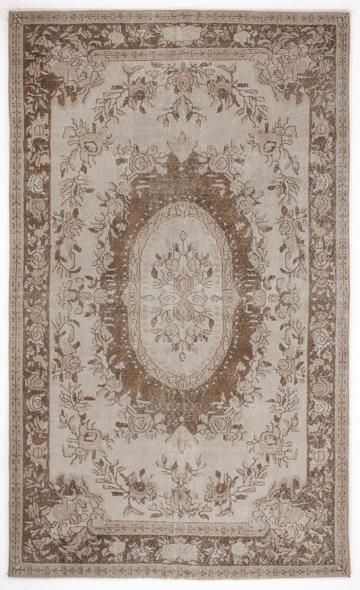 Beige and brown vintage-style rug with a central floral medallion and ornate botanical border.