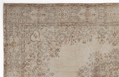 Load image 1 in gallery view. Beige and brown traditional rug with a distressed floral medallion pattern and a detailed border.