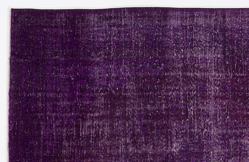 Load image 1 in gallery view. Deep purple vintage-style rug with a distressed, faded traditional medallion pattern.
