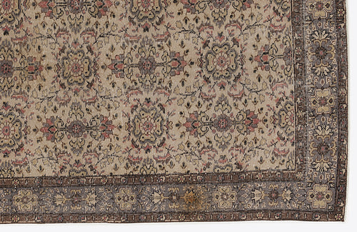 Load image 1 in gallery view. Beige, grey, and muted red traditional rug with a distressed floral medallion pattern and a dark decorative border.