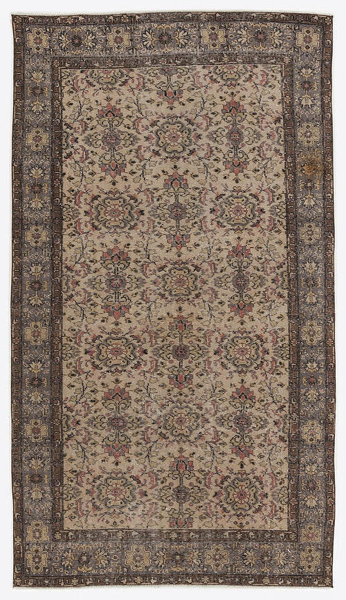 Load image 1 in gallery view. Beige and charcoal traditional rug with a repeating floral medallion pattern and a wide, ornate border.