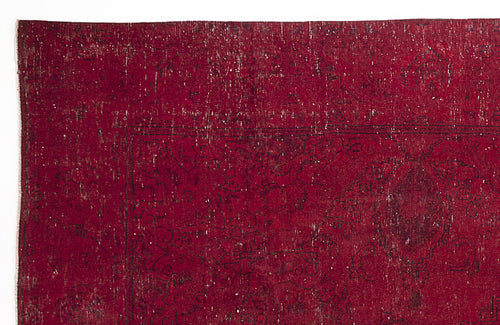 Load image 1 in gallery view. Deep red vintage-style rug with a distressed, faded black floral medallion pattern and white worn detailing.