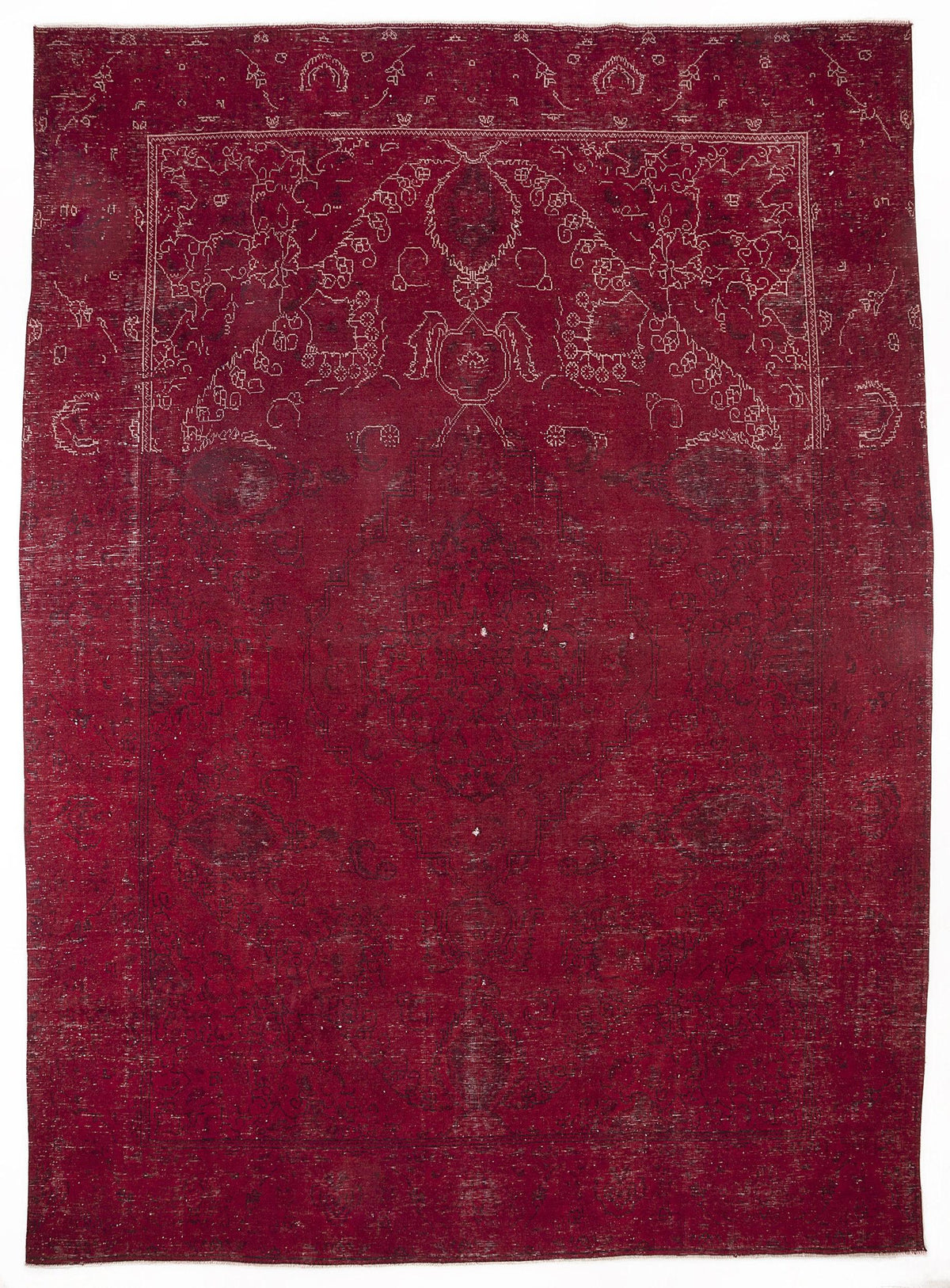 Deep red vintage-style rug with a distressed finish and white linear floral medallion patterns.