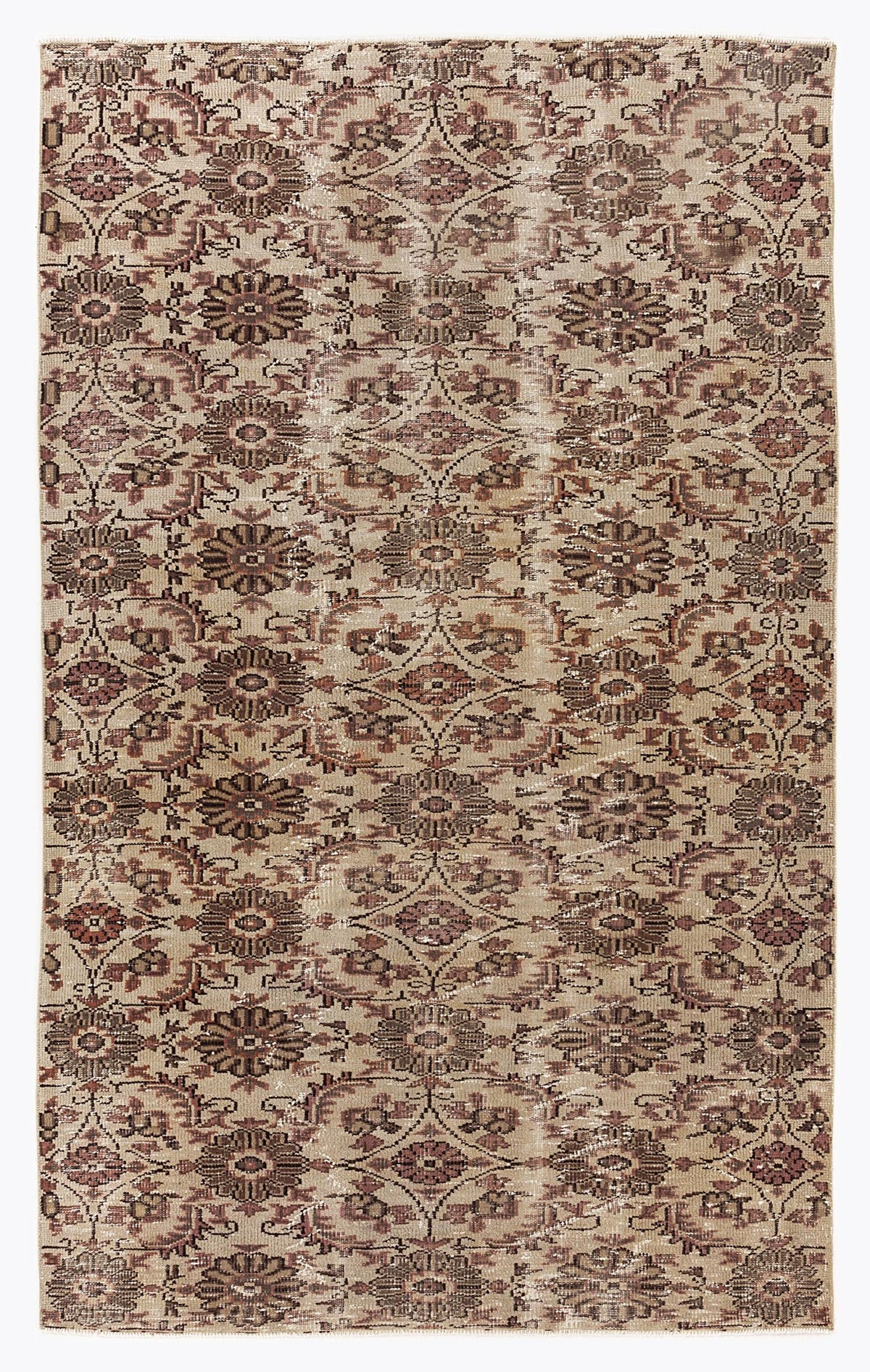 Beige and brown vintage-style rug with a repeating floral medallion pattern and a distressed, faded finish.