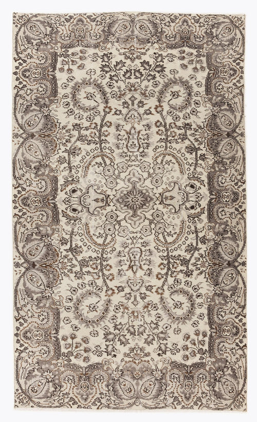Load image 1 in gallery view. Cream and grey traditional rug with a distressed floral medallion pattern and ornate border.