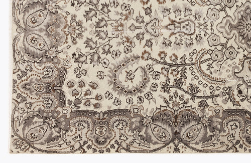 Load image 1 in gallery view. Cream, taupe, and brown rug with a distressed traditional Persian-style floral medallion pattern.