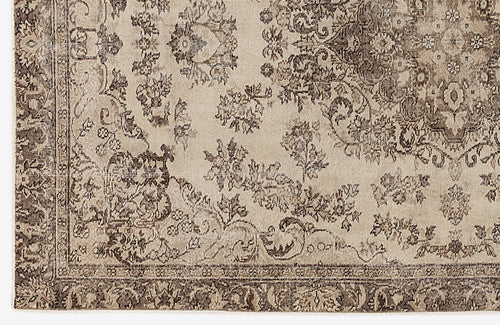 Load image 1 in gallery view. Beige and brown rug with a distressed traditional floral medallion pattern and a detailed border.