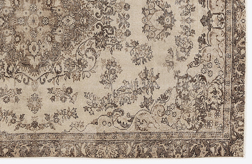 Load image 1 in gallery view. Beige and dark brown traditional rug with a distressed floral medallion pattern and a detailed border.