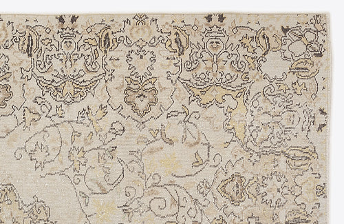 Load image 1 in gallery view. Beige and cream area rug with a distressed, traditional floral medallion pattern in charcoal and muted gold.