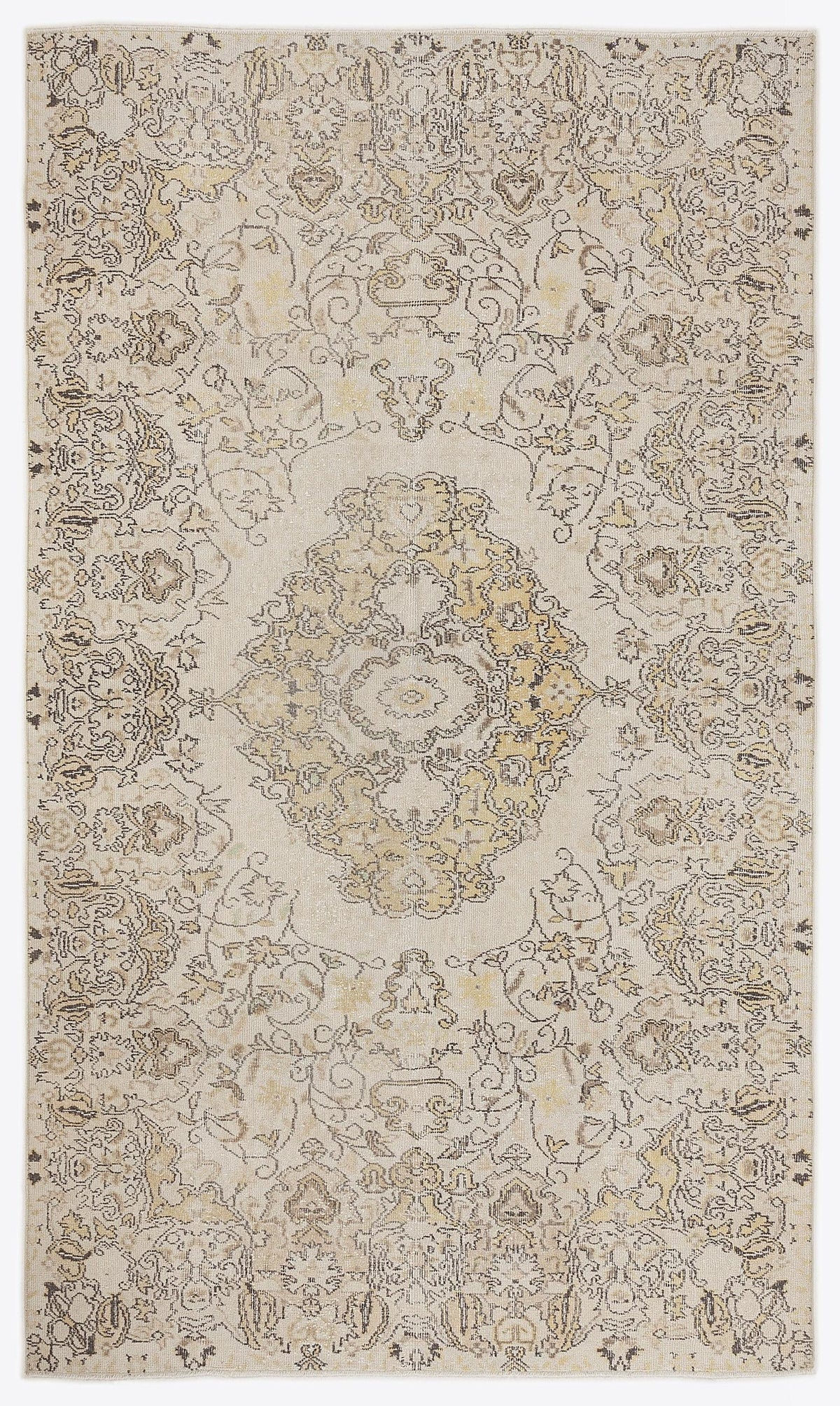 Cream and beige traditional rug with a distressed floral medallion pattern and intricate border details.