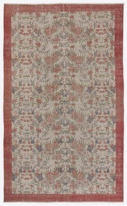 Load image 1 in gallery view. Beige rug with a red border and a repeating floral pattern in muted red, green, and blue tones.