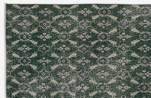 Load image 1 in gallery view. Dark green rug with a repeating light grey floral medallion and lattice pattern.