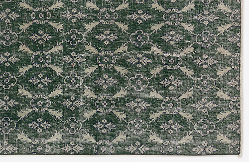 Load image 1 in gallery view. Dark green rug with a repeating cream-colored floral medallion and lattice pattern.