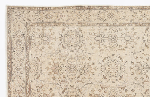 Load image 1 in gallery view. Beige and taupe traditional rug with a faded floral medallion pattern and a detailed geometric border.
