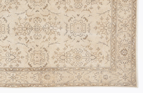 Load image 1 in gallery view. Beige and taupe rug with a traditional floral medallion pattern and a detailed border on a white background.