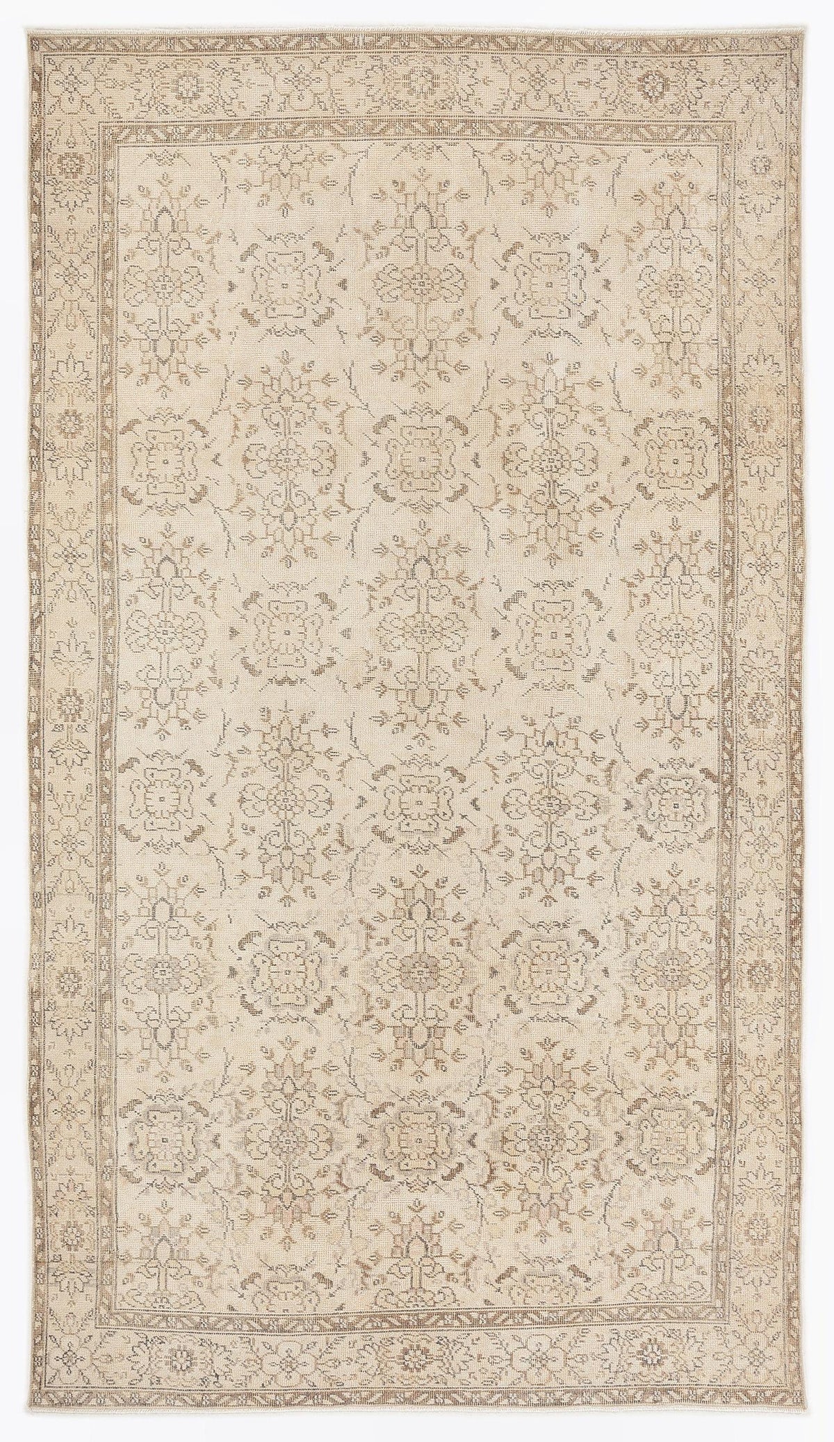 Beige and taupe traditional rug with a repeating floral medallion pattern and a detailed border.