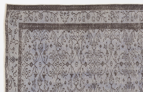 Load image 1 in gallery view. Grey and charcoal rug with a distressed, traditional medallion pattern and a wide decorative border.