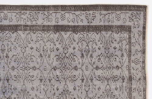 Load image 1 in gallery view. Charcoal and light gray rug with a distressed traditional floral medallion pattern and a bordered edge.