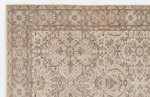Load image 1 in gallery view. Beige and brown rug with a distressed traditional floral medallion pattern and a detailed border.