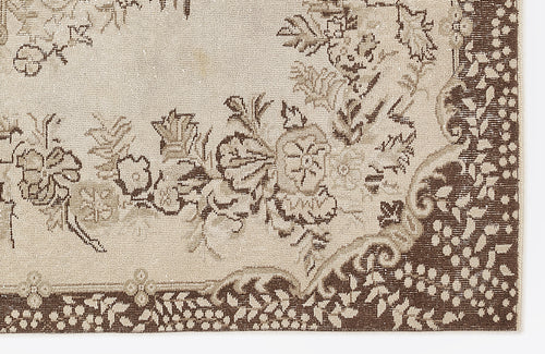 Load image 1 in gallery view. Beige and brown rug with a traditional floral medallion pattern and a detailed botanical border.