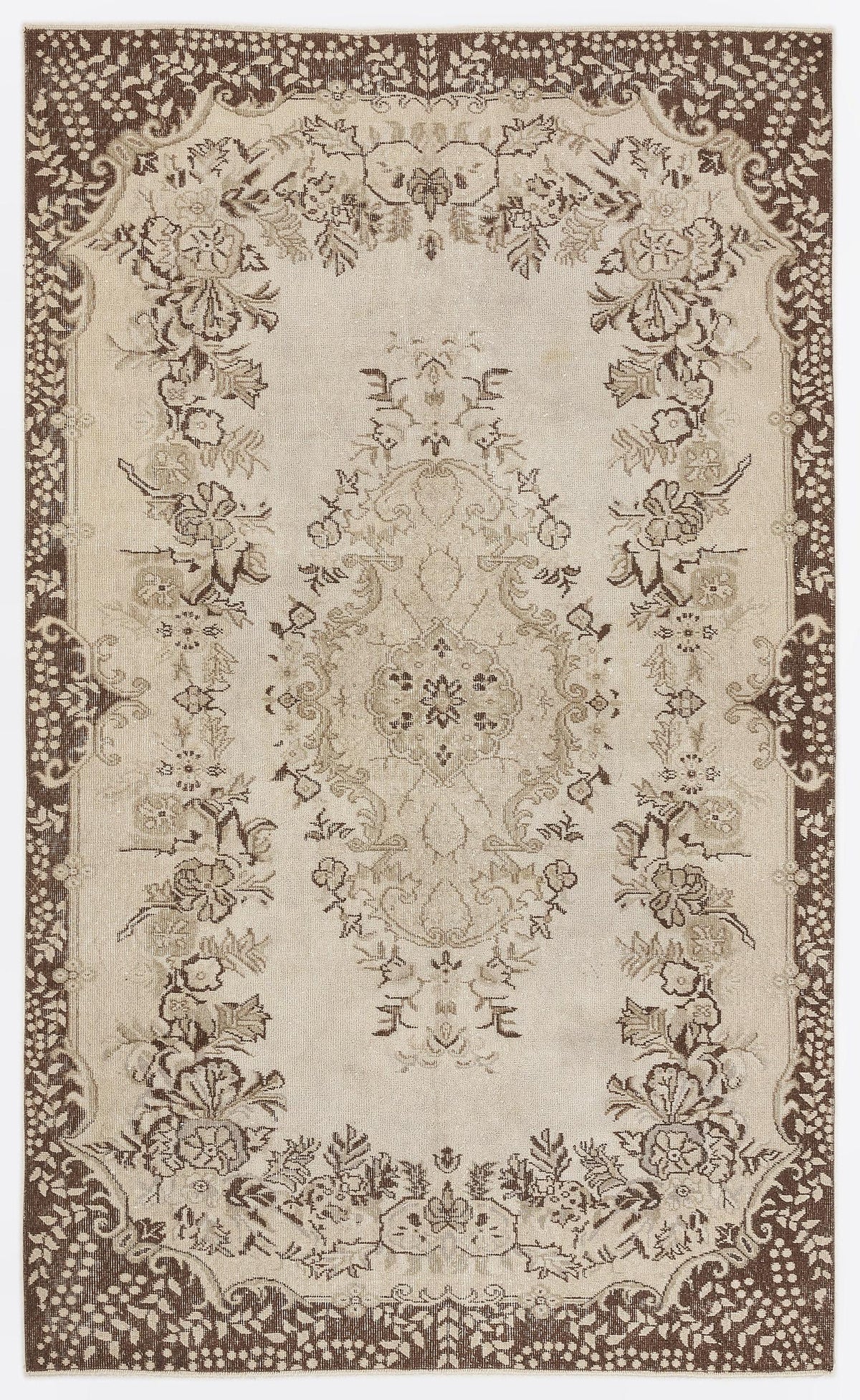 Beige and brown traditional rug with a central floral medallion and ornate botanical border on a white background.