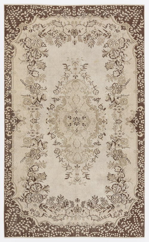 Load image 1 in gallery view. Beige and brown traditional rug with a central floral medallion and ornate botanical border on a white background.