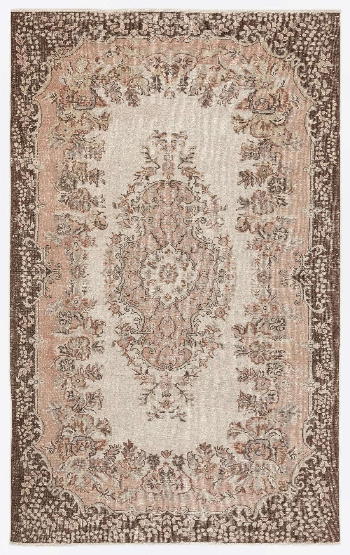 Beige, pink, and brown traditional rug with a central floral medallion and a dark ornate border.