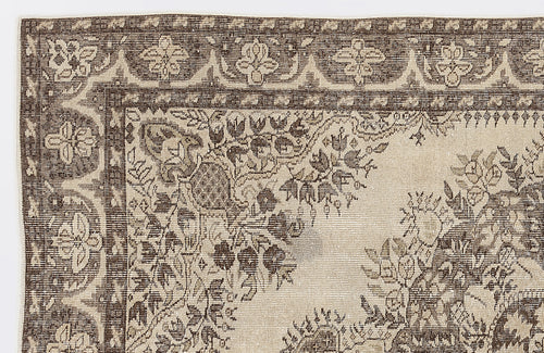 Load image 1 in gallery view. Dark brown and beige rug with a traditional floral medallion pattern and ornate border on a white background.