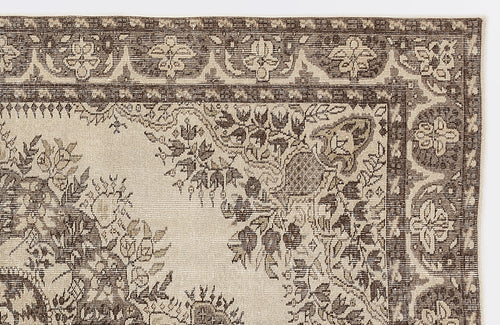 Load image 1 in gallery view. Dark brown and cream rug with a traditional floral medallion pattern and a detailed geometric border.