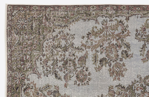 Load image 1 in gallery view. Distressed sage green and grey rug with a faded traditional floral medallion pattern.