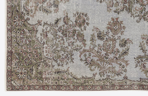 Load image 1 in gallery view. Distressed light blue rug with a faded floral medallion pattern in olive green and brown tones.