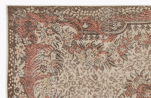 Load image 1 in gallery view. Brown, beige, and terracotta traditional rug with a dense, distressed floral and vine pattern.