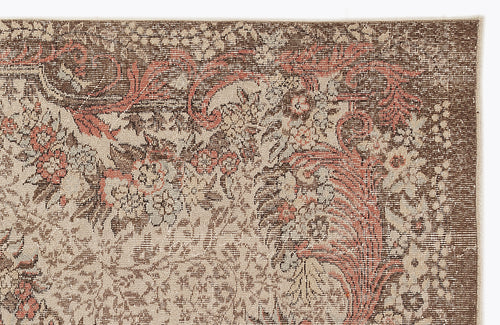 Load image 1 in gallery view. Brown, beige, and terracotta traditional floral medallion rug with a distressed, weathered texture.