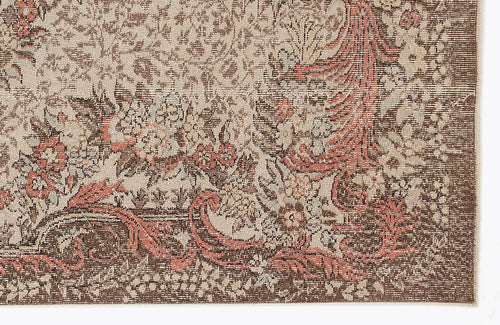 Load image 1 in gallery view. Brown, beige, and terracotta floral medallion rug with a distressed, traditional pattern on a white background.