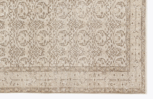 Load image 1 in gallery view. Beige and taupe traditional rug with a distressed floral medallion pattern and a detailed border.