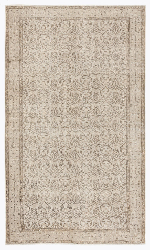 Load image 1 in gallery view. Beige and taupe traditional rug with a distressed, repeating medallion pattern and a decorative border.