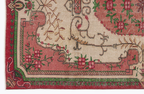 Load image 1 in gallery view. Beige, red, and green traditional rug with a floral medallion pattern and geometric border.