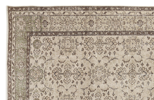 Load image 1 in gallery view. Beige and brown traditional rug with a distressed floral medallion pattern and a decorative border.