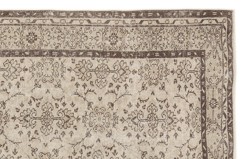 Load image 1 in gallery view. Beige and dark brown rug with a traditional floral medallion pattern and a decorative border.