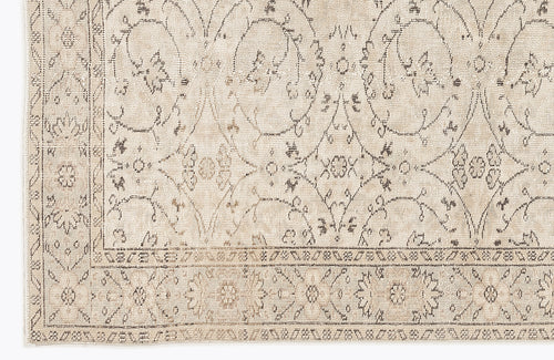 Load image 1 in gallery view. Beige and taupe rug with a distressed traditional floral medallion pattern and a detailed border.