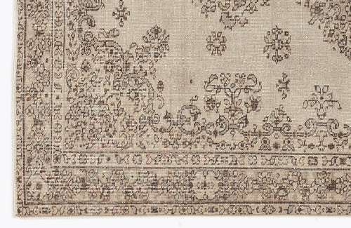 Load image 1 in gallery view. Beige and brown rug with a distressed traditional floral medallion pattern and a geometric border.