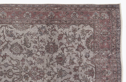 Load image 1 in gallery view. Muted mauve and grey traditional rug with a distressed floral pattern and a detailed border.