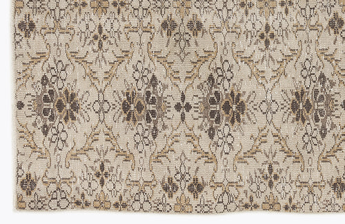 Load image 1 in gallery view. Beige and brown rug with a distressed, repeating floral medallion pattern.