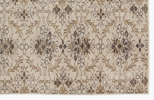 Load image 1 in gallery view. Beige and brown rug with a repeating distressed floral medallion pattern.
