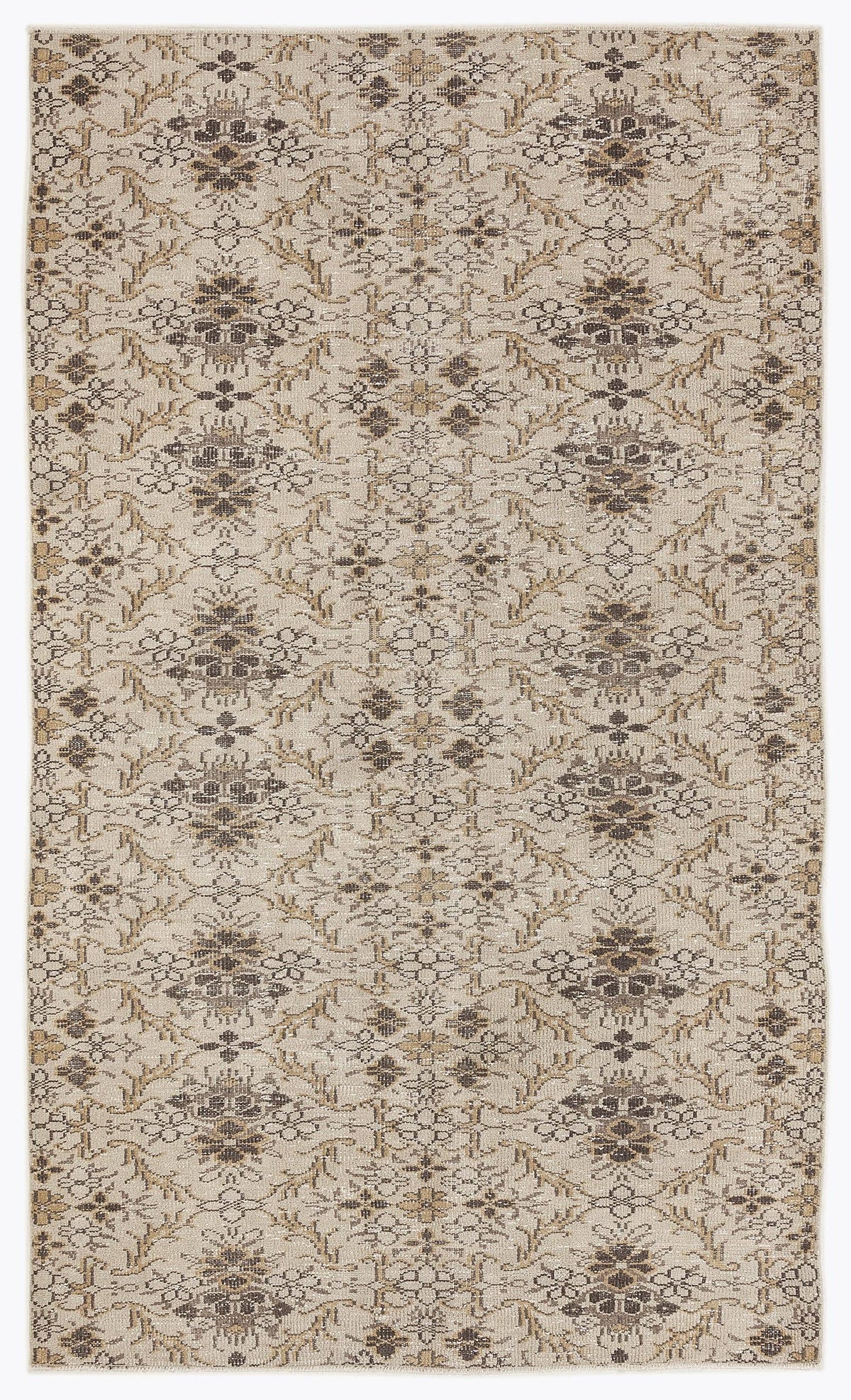 Beige and brown rug with a repeating floral medallion pattern and distressed texture on a white background.