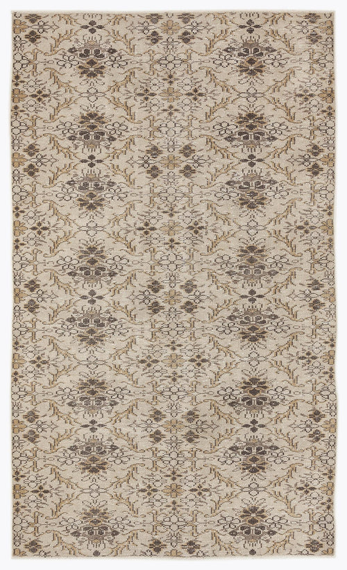 Load image 1 in gallery view. Beige and brown rug with a repeating floral medallion pattern and distressed texture on a white background.