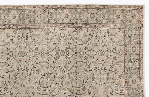 Load image 1 in gallery view. Beige and taupe traditional rug with a distressed floral medallion pattern and a decorative border.