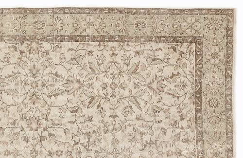 Load image 1 in gallery view. Beige and brown traditional rug with a distressed floral medallion pattern and a detailed border.