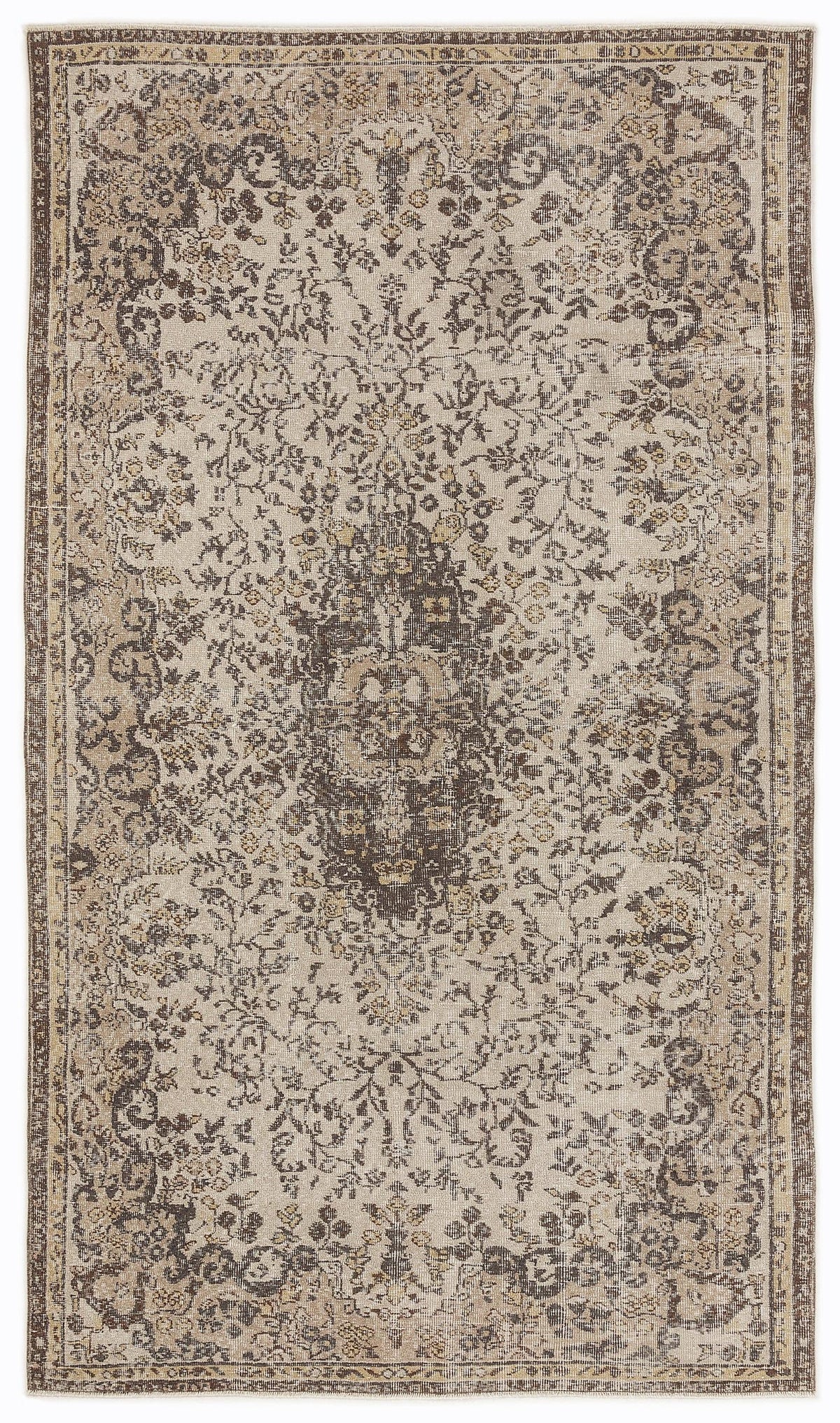 Beige and dark brown traditional rug with a distressed floral medallion pattern and a decorative border.