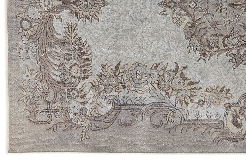 Load image 1 in gallery view. Grey and brown rug with a distressed traditional floral medallion pattern.